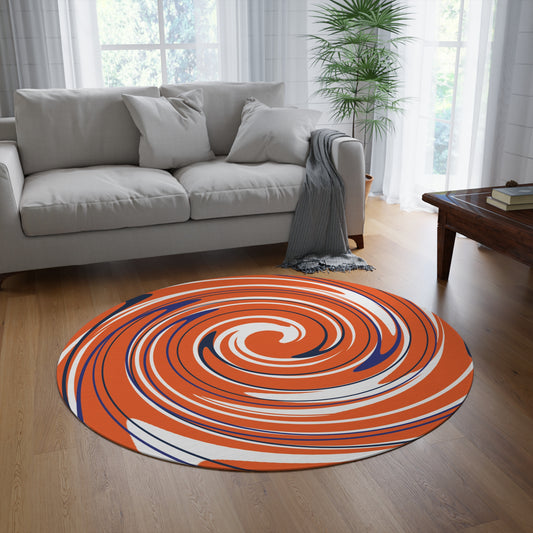 Round orange, blue, and white spiral rug in a living room with a gray sofa and wooden coffee table.