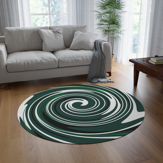 Round green and white rug on a wooden floor in a living room with a gray sofa and coffee table.