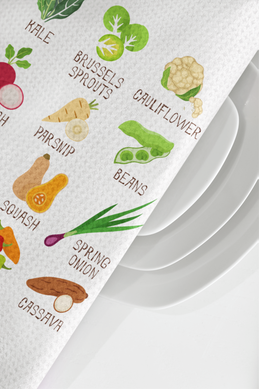 Paper towel with vegetable illustrations and text on a white background