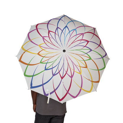 Colorful umbrella with a geometric pattern held by a person on a white background