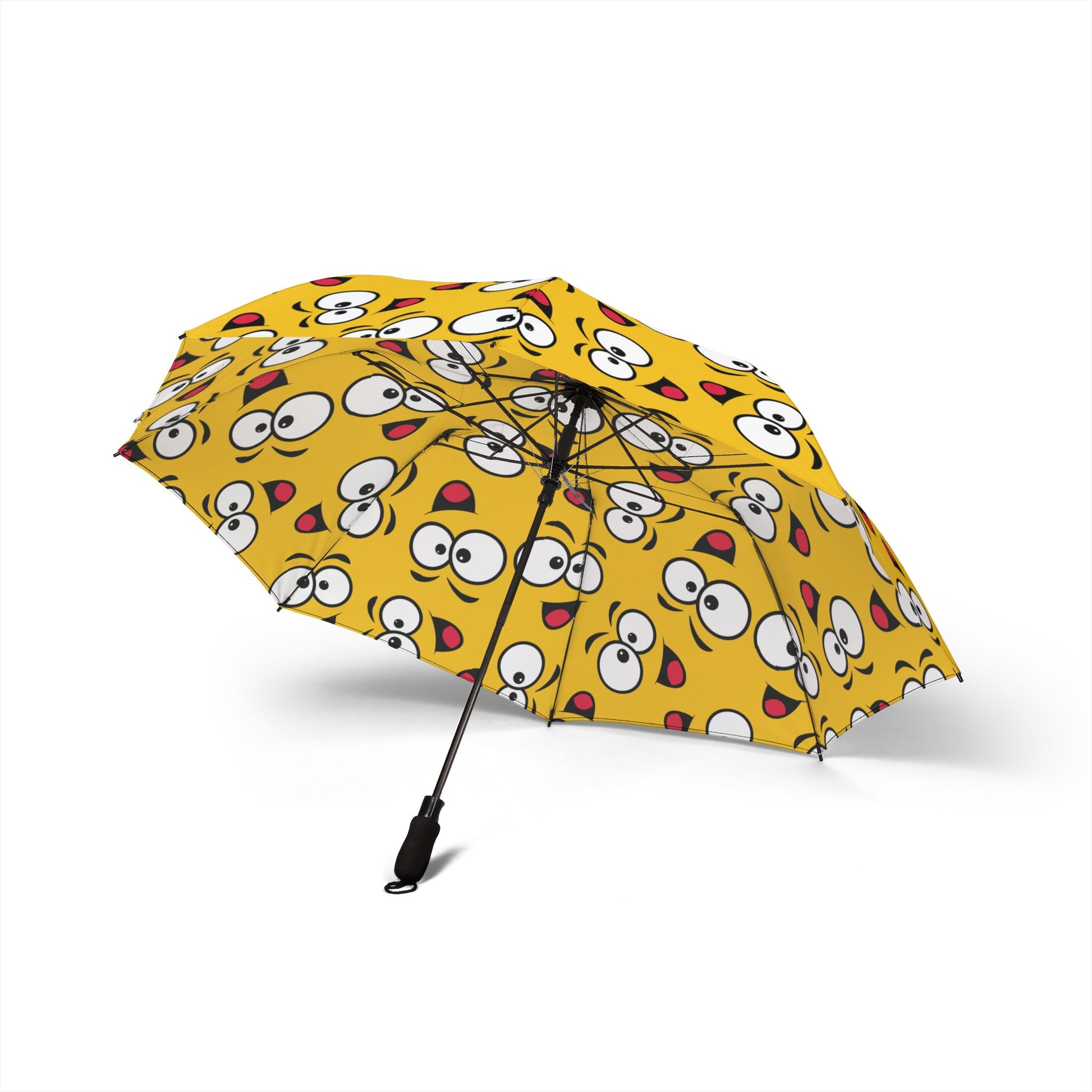 Yellow umbrella with cartoon face pattern on a white background