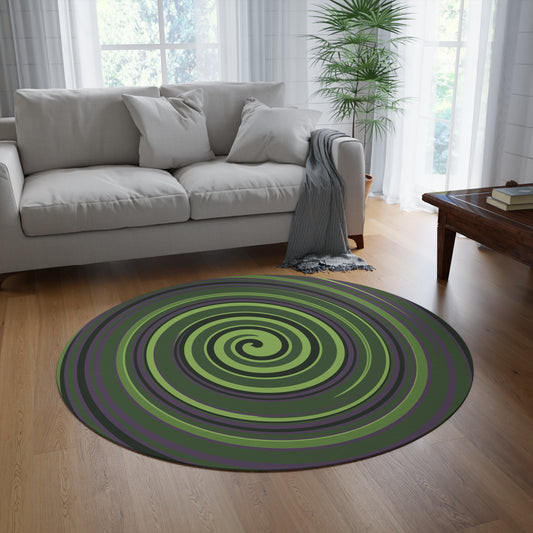 Round green and purple spiral rug in a living room with a gray sofa and wooden coffee table.