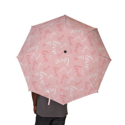 Floral-patterned umbrella held by a person on a white background