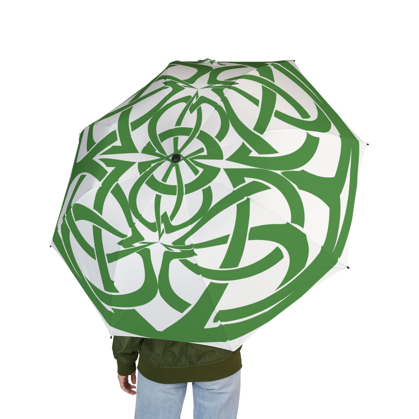 Green and white patterned umbrella held by a person on a white background