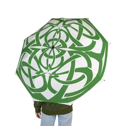 Green and white patterned umbrella held by a person on a white background