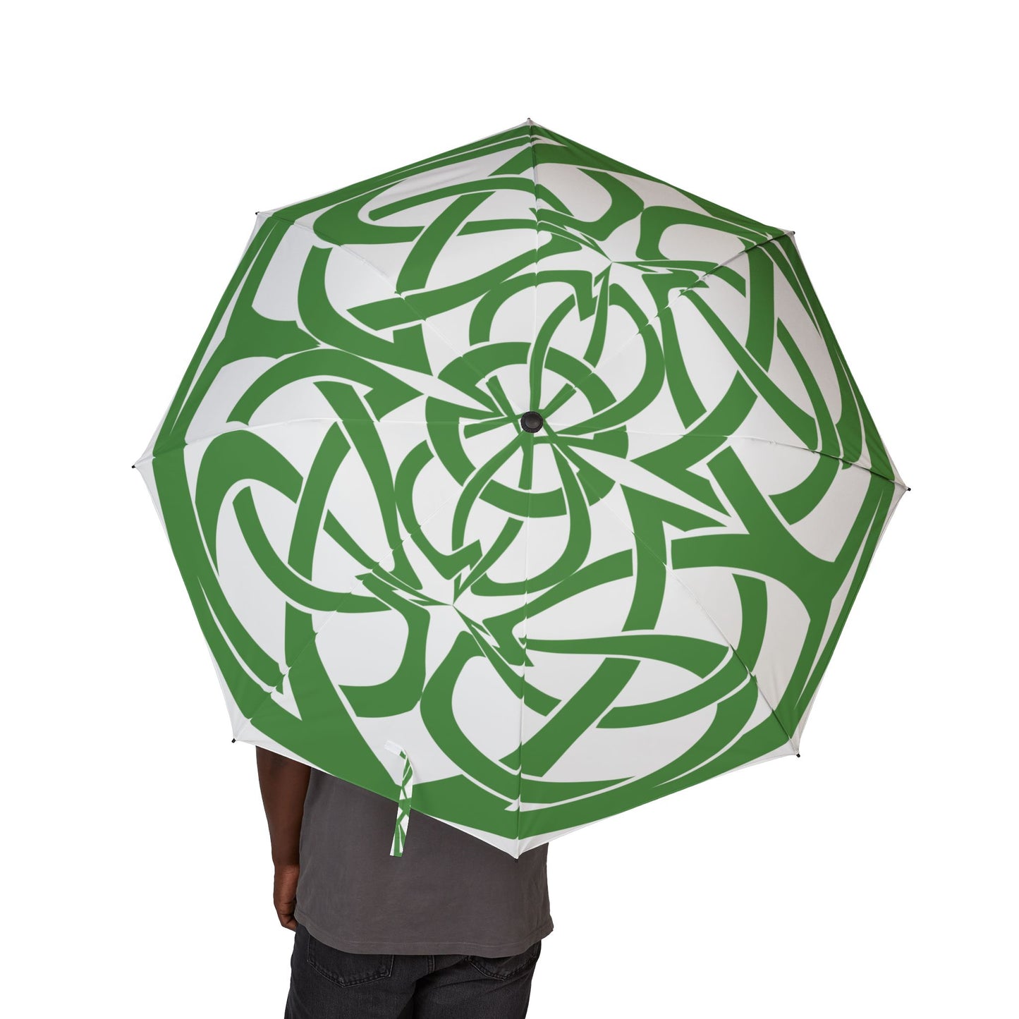 Green and white patterned umbrella held by a person on a white background