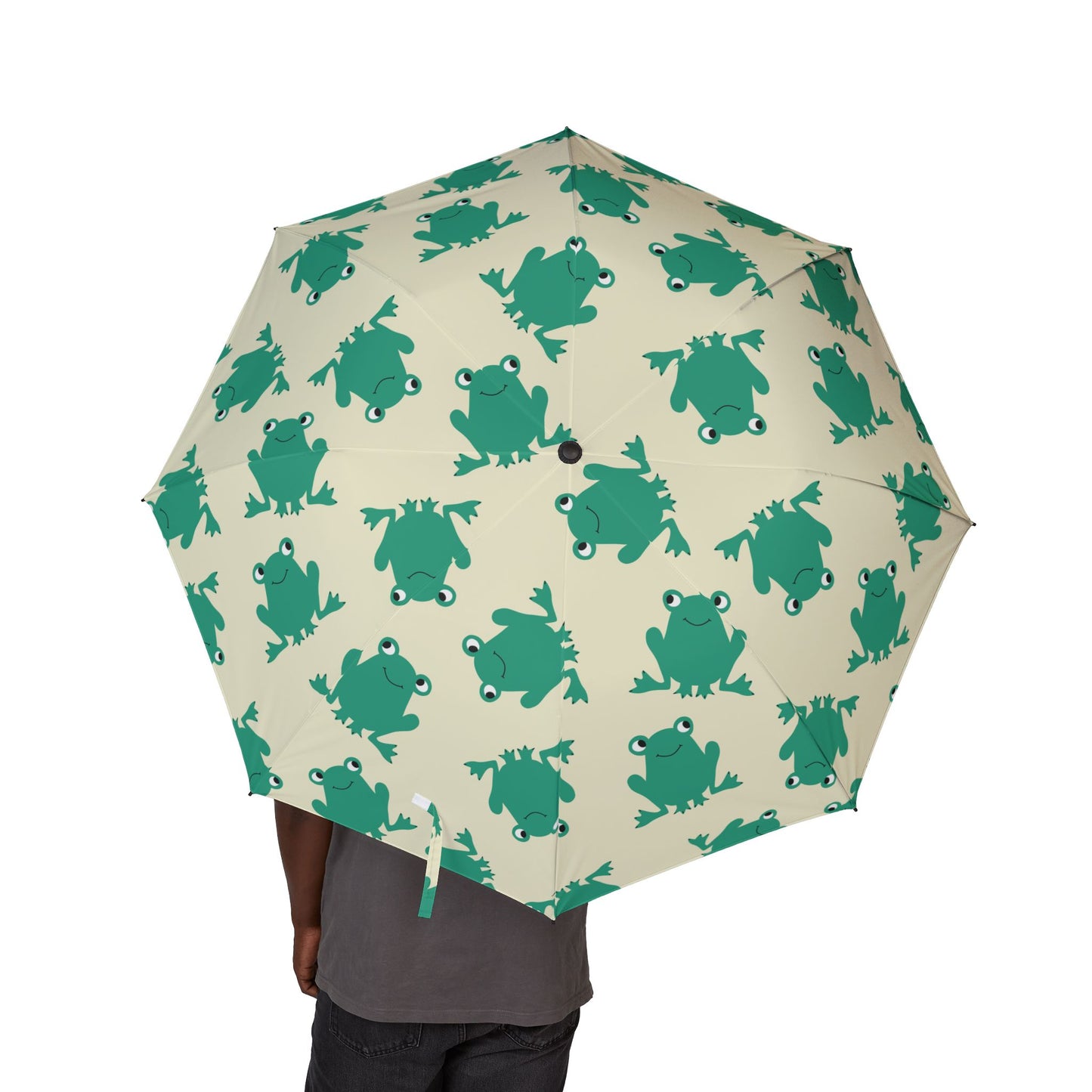 Umbrella with green frog pattern on a beige background