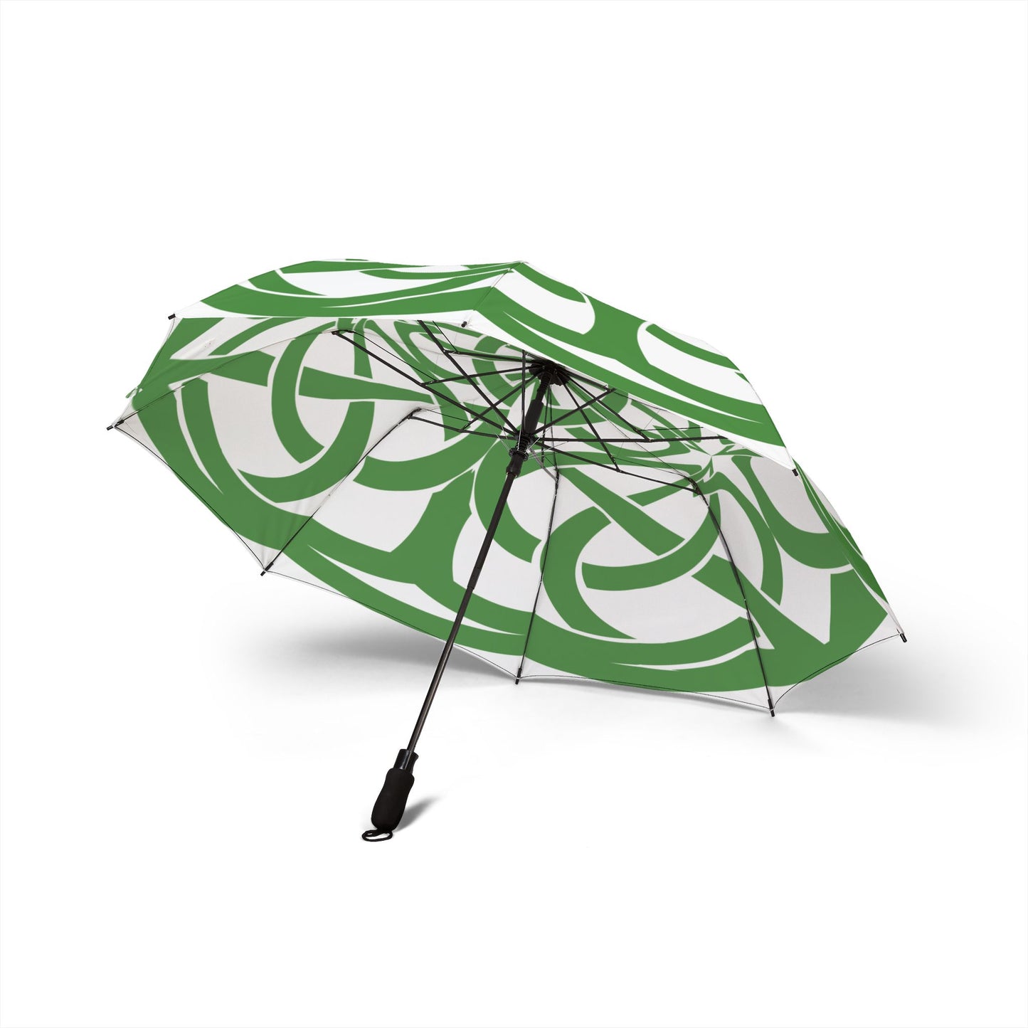 Green and white patterned umbrella on a white background