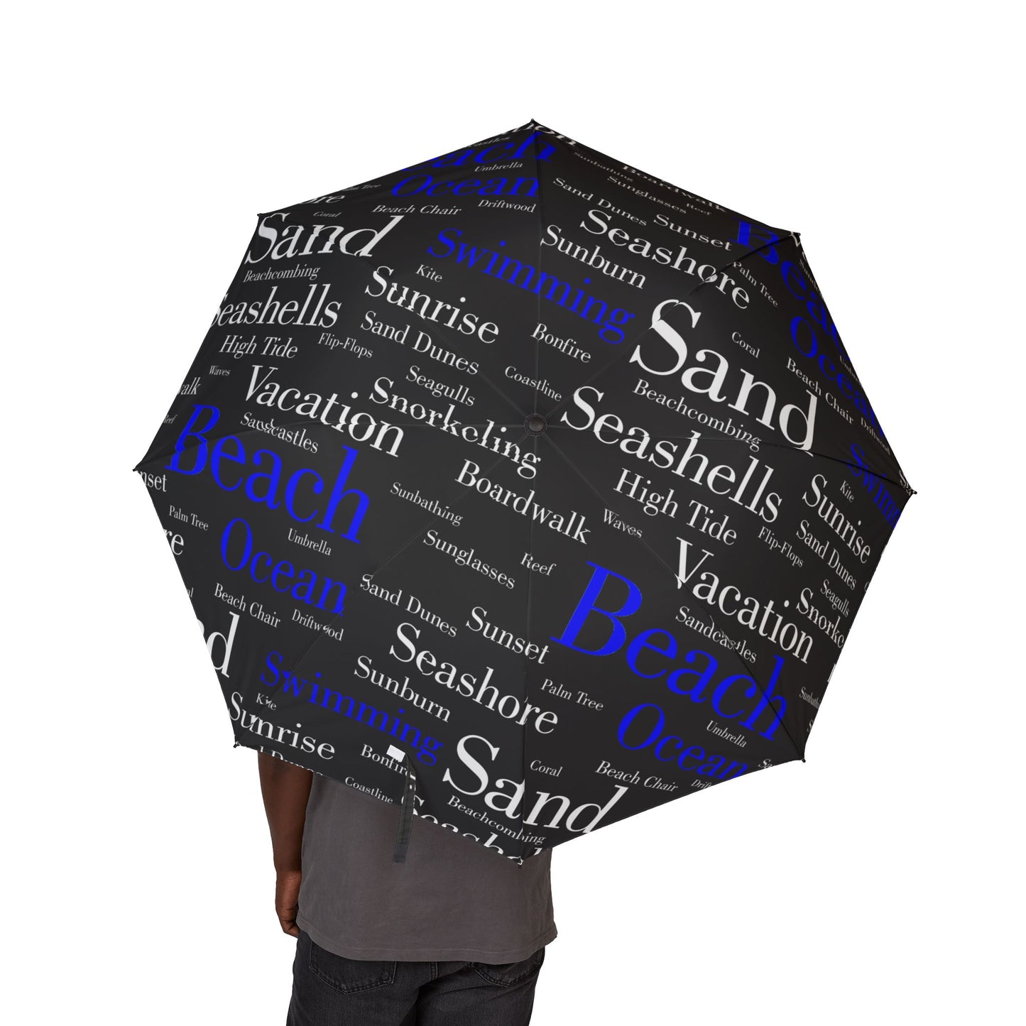 Umbrella with beach-themed word cloud design on a white background