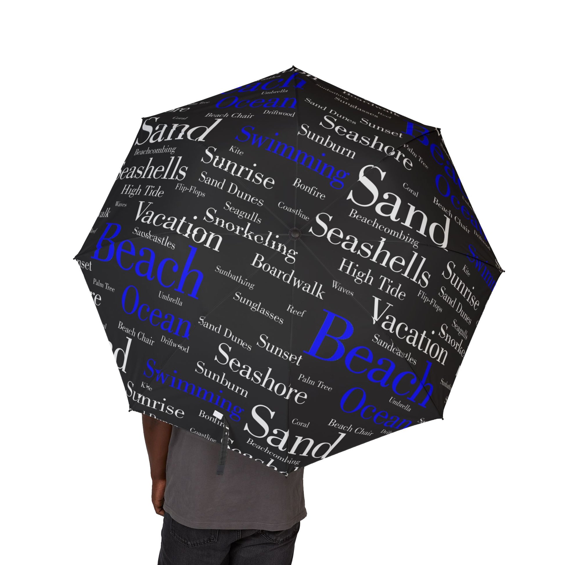 Umbrella with beach-themed word cloud design on a white background
