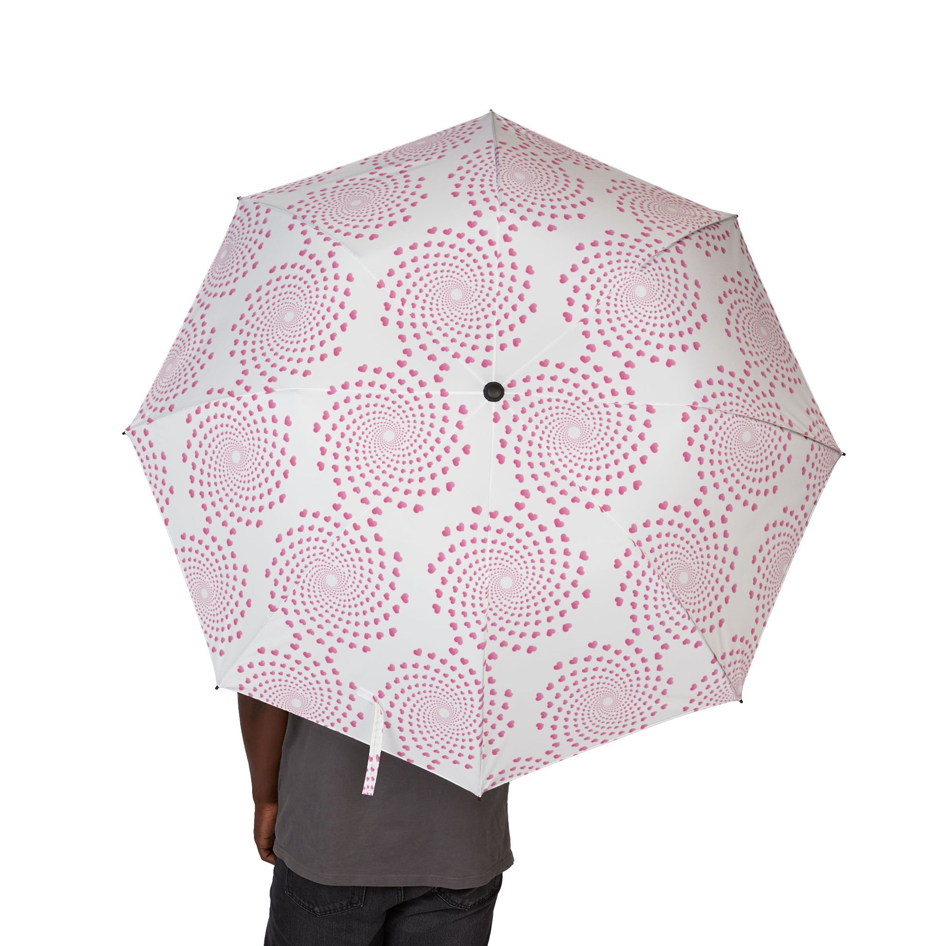 Umbrella with pink circular pattern on a white background